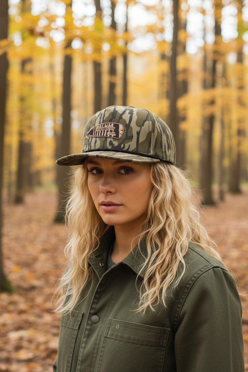 Broken Antler Hat Co. Mossy Oak camo snapback hat with embroidered logo patch. Adjustable fit for outdoor wear.